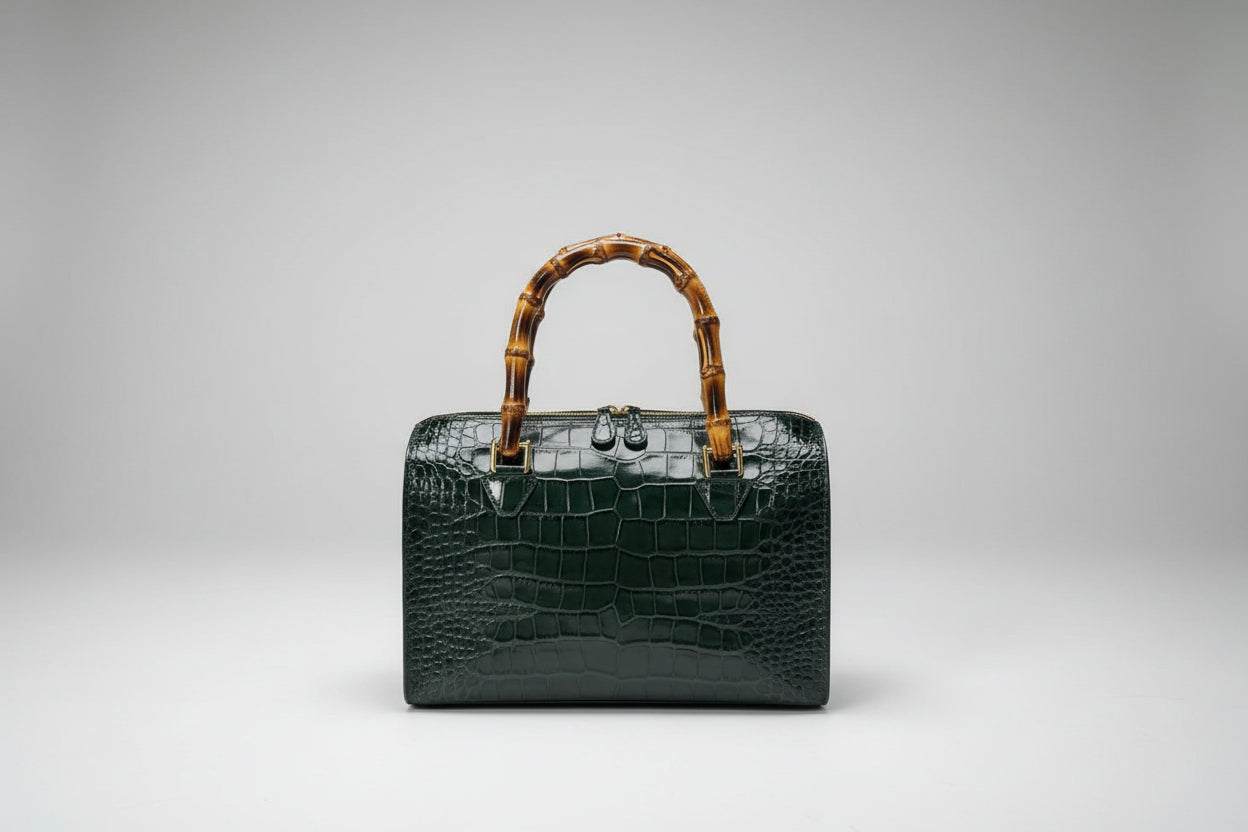 The Gabby Italian leather handbag in mock croc leather, bamboo handles in the color dark money green- front view